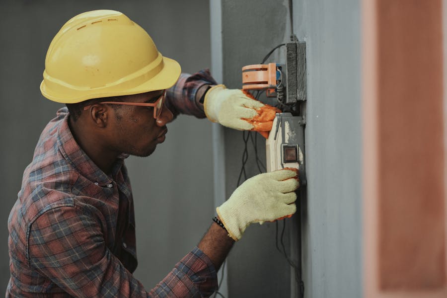 BJE Appliance Repair Atlanta technician inspecting an appliance control panel during a service call