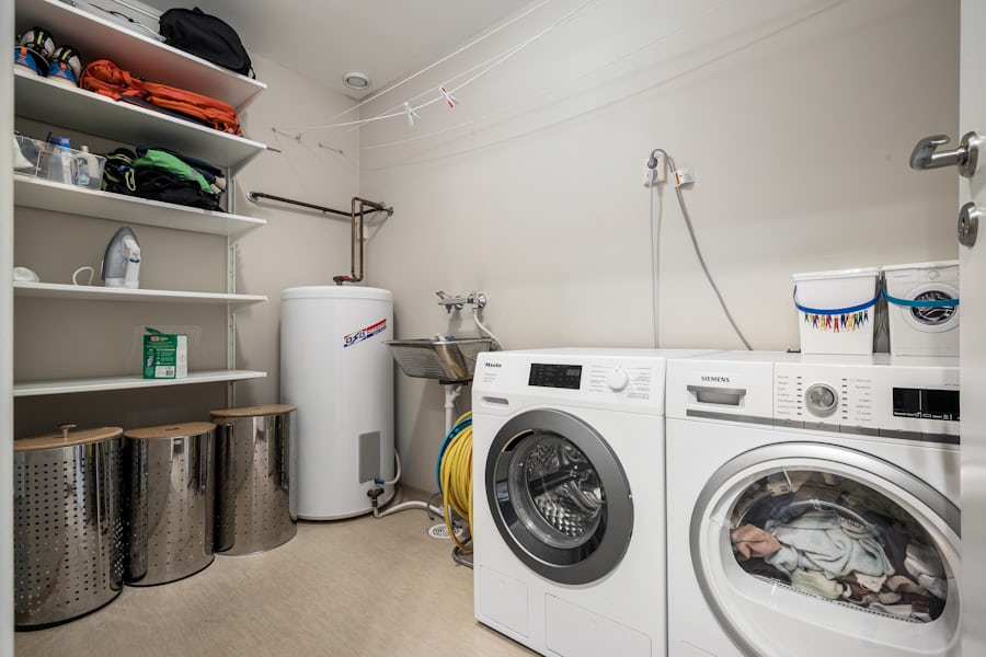 Atlanta laundry room dryer being inspected for fire safety warning signs